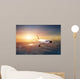 Airplane in the sky at sunset Wall Mural