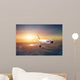 Airplane in the sky at sunset Wall Mural