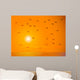 Flying Birds Against Orange Sunset Wall Mural