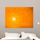 Flying Birds Against Orange Sunset Wall Mural