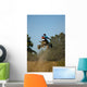 Teenager on a Yellow Quad Bike Jumping Wall Mural