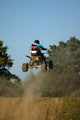 Teenager on a Yellow Quad Bike Jumping Wall Mural