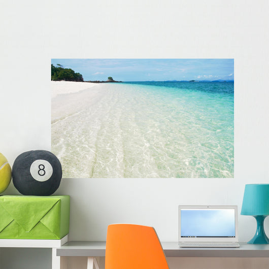 Deserted tropical beach with blue sky Wall Mural