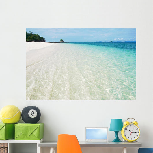 Deserted tropical beach with blue sky Wall Mural