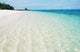 Deserted tropical beach with blue sky Wall Mural