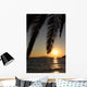 Palm leafs and sea in the evening, sunset Wall Mural