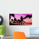 Palms silhouettes at sunset on a tropical beach Wall Mural