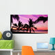 Palms silhouettes at sunset on a tropical beach Wall Mural