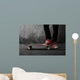 Legs in sneakers on a skateboard Wall Mural