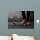 Legs in sneakers on a skateboard Wall Mural