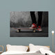 Legs in sneakers on a skateboard Wall Mural