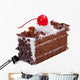 Chocolate cake topping with mousse chocolates ships and cherry o Wall Decal