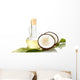 decanter with coconut oil and coconuts isolated on white Wall Decal