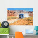 Semi-truck driving across the desert Wall Mural