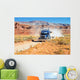 Semi-truck driving across the desert Wall Mural