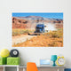 Semi-truck driving across the desert Wall Mural