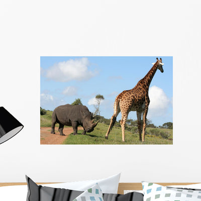 Rhino and Giraffe Interaction Wall Mural shown on a wall