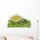 Olive oil in a bowl with fresh green olives Wall Mural