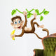 Monkey swinging with banana Wall Decal