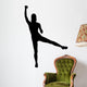 A silhouette of an attractive woman lifting weights Wall Decal
