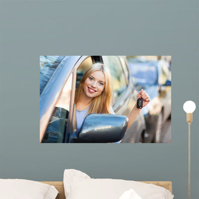 Young Woman Showing Car shown on a wall