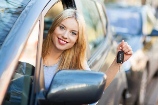 Young Woman Showing Car