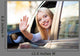 Young woman waving from car window Wall Mural