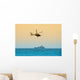 helicopter hovering over battleship Wall Mural