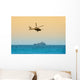 helicopter hovering over battleship Wall Mural