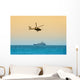 helicopter hovering over battleship Wall Mural