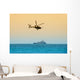 helicopter hovering over battleship Wall Mural