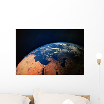 Earth from Space Wall Mural shown on a wall