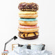 A Stack of Donuts on White Background Wall Decal