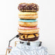 A Stack of Donuts on White Background Wall Decal