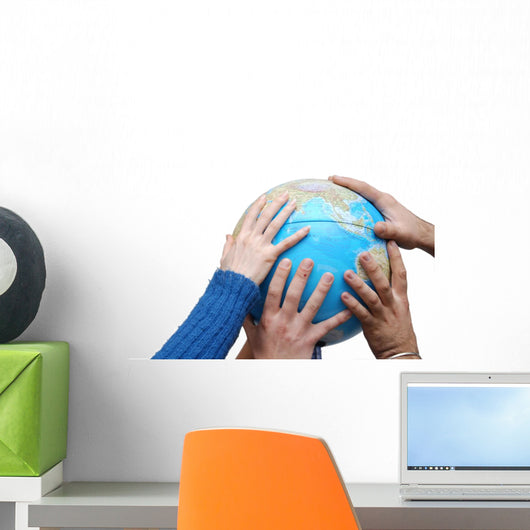 Teamwok concept with hands on globe Wall Decal