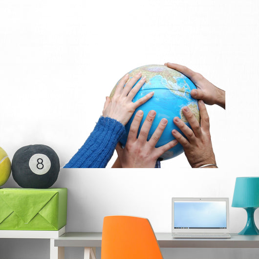 Teamwok concept with hands on globe Wall Decal