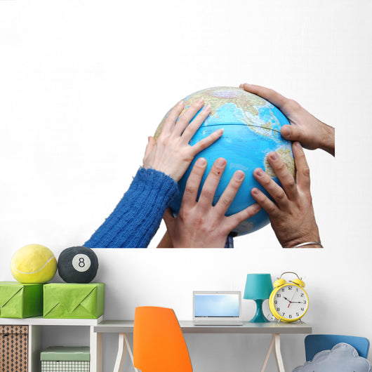 Teamwok concept with hands on globe Wall Decal