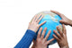 Teamwok concept with hands on globe Wall Decal