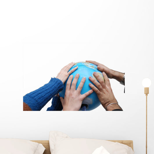 Teamwok concept with hands on globe Wall Decal