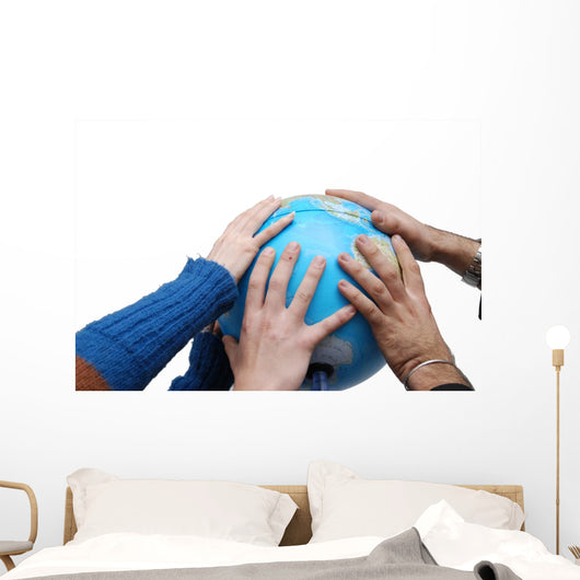 Teamwok concept with hands on globe Wall Decal