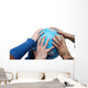 Teamwok concept with hands on globe Wall Decal