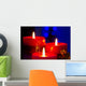 Christmas candles with blurry lights on background Wall Mural