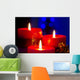 Christmas candles with blurry lights on background Wall Mural