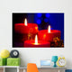 Christmas candles with blurry lights on background Wall Mural