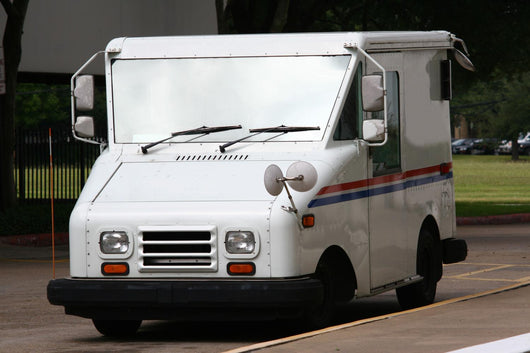 White Mail Truck Delivering Mail Wall Mural