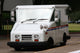 White Mail Truck Delivering Mail Wall Mural