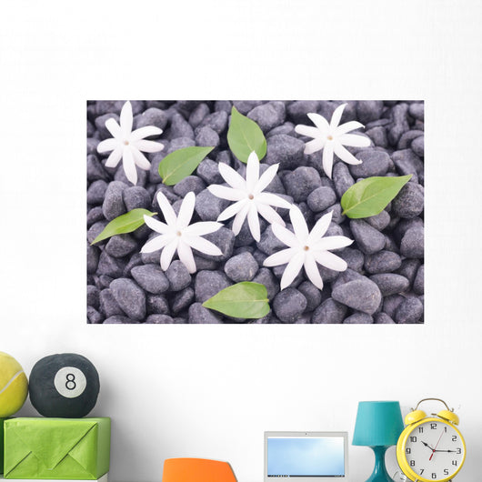White Jasmine Flowers and Leaves over Zen Stones Background Wall Mural