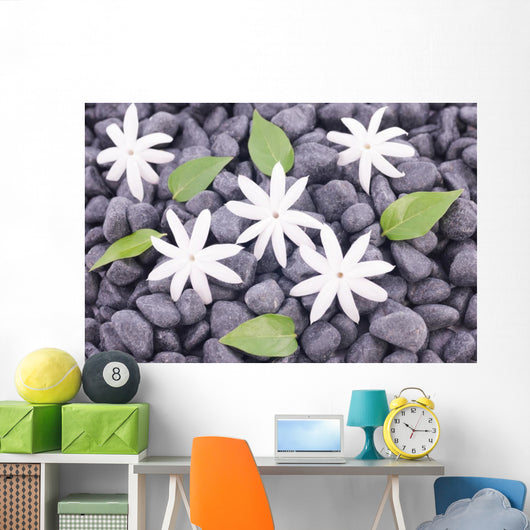 White Jasmine Flowers and Leaves over Zen Stones Background Wall Mural