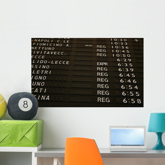 Train schedule board with departure times Wall Mural