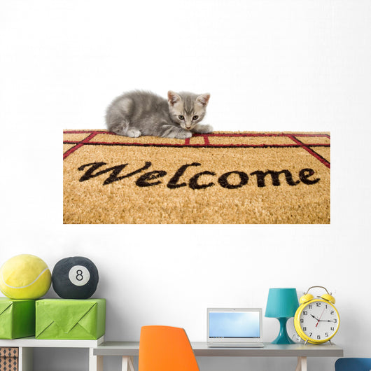 Kitten and welcome mat Wall Mural